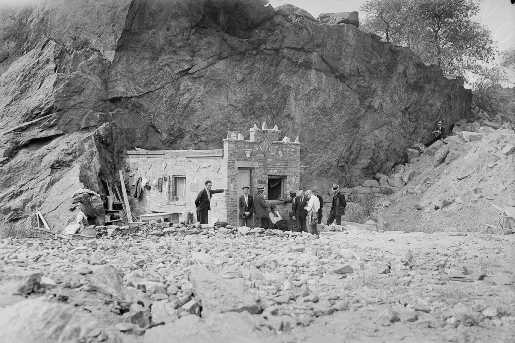 UNITED STATES - SEPTEMBER 22: Inhabitants of Hooverville gather outside the Mansion, town's chief edifice, which snuggles in lee of rocky cliff to protect it from wintry winds. (Photo by NY Daily News Archive via Getty Images)